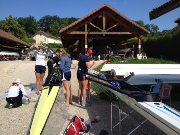 Rigging the boats for training at Aviron du Lac Bleu in Paladru, France.
