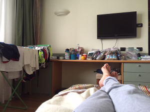 Reading during a rainy afternoon in our hotel room in Erba, Italy. Laundry on the left and enough Clif bars and snacks for a small army on the desk.